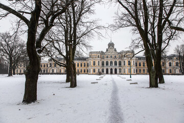 A beautiful and old abandoned manor. Antique architecture. An ancient building. Winter day.