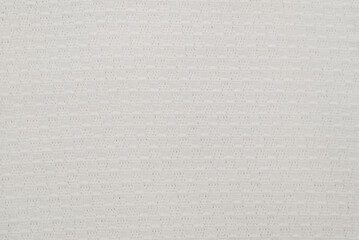 the background of a white knit fabric copy space. soft knitwear structure