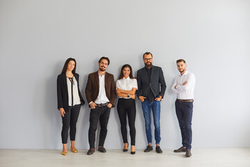Group of smiling business people colleagues standing in office