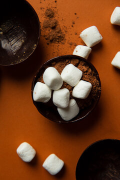 Partially filled chocolate shells for hot chocolate bombs.