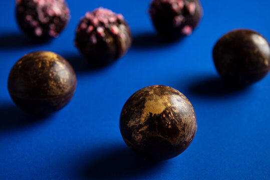 Hot chocolate bombs on blue background