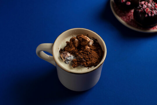 Hot chocolate bomb in mug of hot milk after exploding