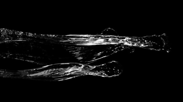Water splashing on black background, super slow motion. Filmed on high speed cinema camera, 1000 fps.