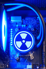 Liquid cooling system inside the computer system unit, gaming PC and the radiation sign