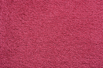 Close-up of a red velvety upholstery fabric