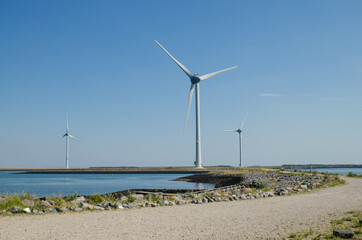 Oosterscheldekering, the netherlands, August 2019. In the Zeeland countryside, wind farms: a particular landscape characterized by wind turbines.