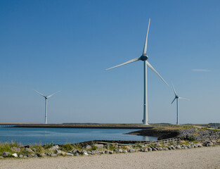 Oosterscheldekering, the netherlands, August 2019. In the Zeeland countryside, wind farms: a particular landscape characterized by wind turbines.