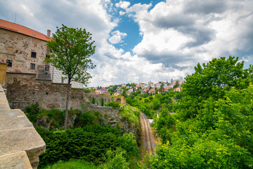 Fototapeta premium Courtyard of Ledec nad Sazavou Castle, Czech Republic. View from castle tower in summer day. Look to railway trail under the bridge.