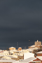 Fototapeta premium Snowed roofs at sunrise, after a blizzard