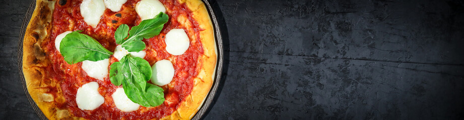 Traditional Brazilian pizza, vegetables, ingredients on a dark aged wooden background. Space for text.