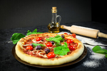 Traditional Brazilian pizza, vegetables, ingredients on a dark aged wooden background. Space for...