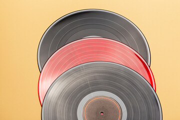 multicolored vinyl records lie on top of each other