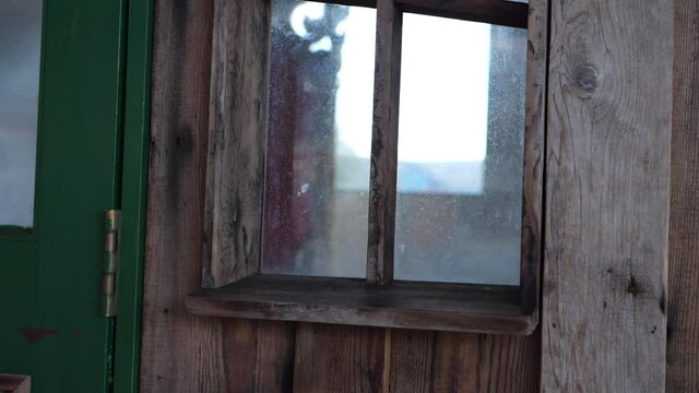Window on old wooden shed outbuilding