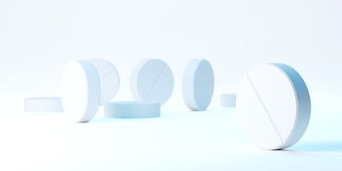White pills over white background blue lit, medical treatment, pharmaceutical or medication concept