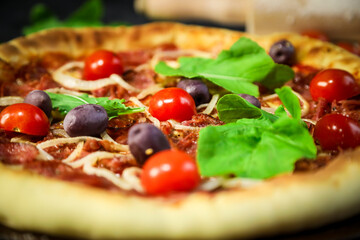 Traditional Brazilian pizza, vegetables, ingredients on a dark aged wooden background. Space for text.