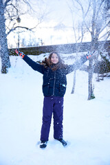 girl playing with snow