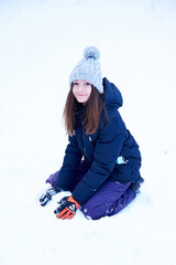 Fototapeta na wymiar girl playing with snow