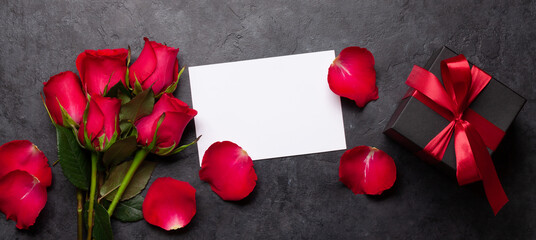 Valentines day greeting card with red rose flowers and gift box