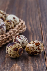 Quail eggs on the wooden plate. Quail eggs can be consumed by frying or boiling. In Indonesia quail eggs called telur puyuh.