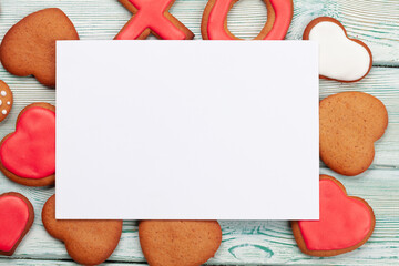 Valentines day greeting card over gingerbread cookies