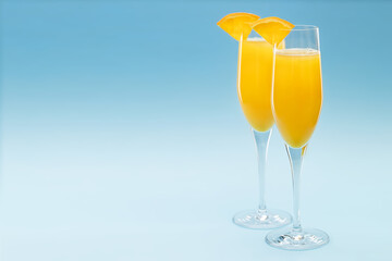 Two glasses of mimosa cocktail - 404602209