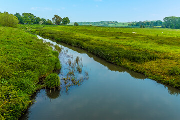 A view down the River Rother from the old bridge at Bodiam, Sussex in springtime