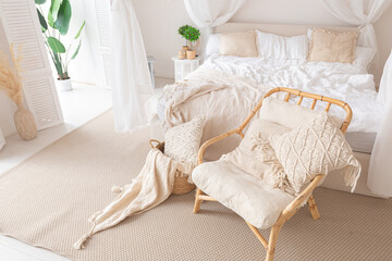 Cozy interior of a bright Balinese-style apartment with white walls, bamboo furniture. bed room with night lights, bed with balanchin and large windows © 4595886