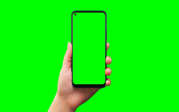 Phone in woman hand isolated in chroma key green