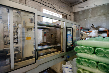 Mass Production Of Plastic. Industrial factory interior with equipment and steel tools.