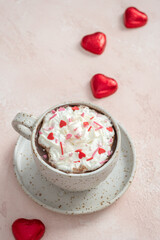 Hot chocolate with red heart candies for valentine's day