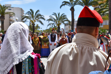 Ibiza Town, Ibiza / Spain - 5 05 19: Selective focus on an woman and man, part of a folklore group, dancing in traditional dress at a celebration of Spanish and Balearic culture