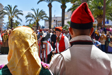 Ibiza Town, Ibiza / Spain - 5 05 19: Selective focus on an woman and man, part of a folklore group, dancing in traditional dress at a celebration of Spanish and Balearic culture