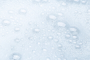 Background of soap foam and bubbles on a white background, macro photography