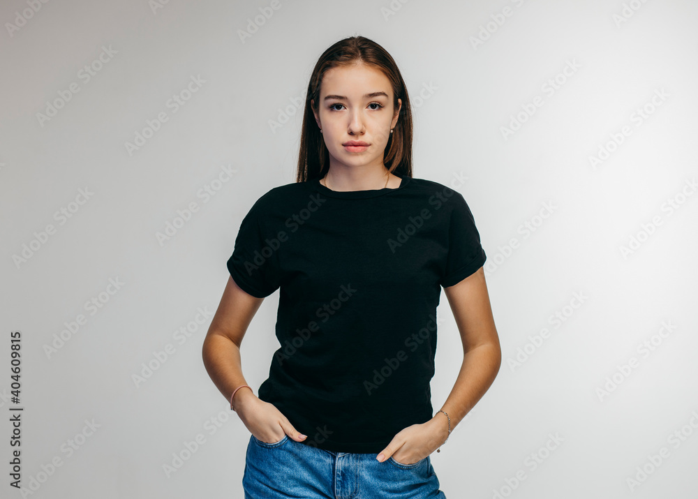 Canvas Prints Stylish girl wearing black t-shirt posing in studio