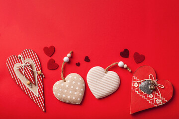 Flatlay hearts on a red background. Valentine's Day background. Copy space.