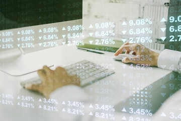 Multi exposure of creative statistics data hologram with hands typing on computer keyboard on background, stats and analytics concept