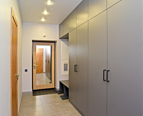 Corridor with mirrored entrance door