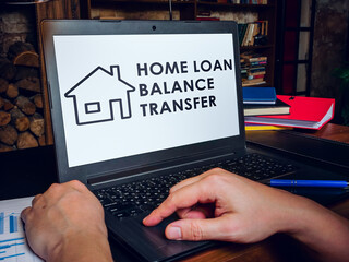 Home loan balance transfer info on laptop screen.