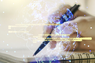 Double exposure of abstract creative programming illustration with world map and woman hand writing in notepad on background, big data and blockchain concept