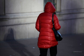 A woman walk through the streets of Sao Paulo, Brazil, during a cold winter morning.