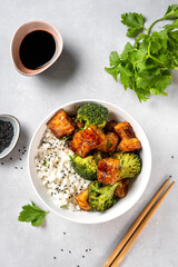 Fried vegan tofu bowl with broccoli and rice