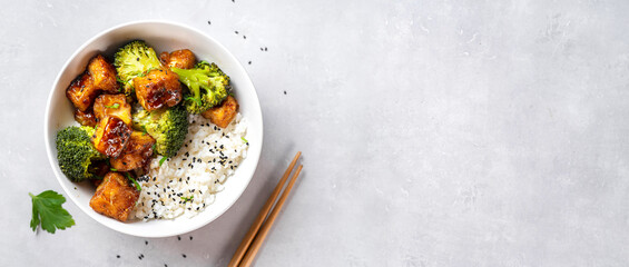 Fried tofu bowl with broccoli and rice. Vegan food