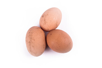 Studio lighting. chicken egg brown, unpeeled. Grown without the use of additives. Ecoproduct. On a white background. Soft focus. Close-up.