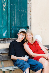 Mother and son sitting on bench