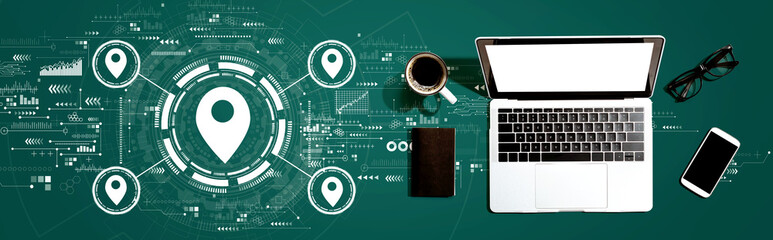 Map pin concept with a laptop computer on a desk