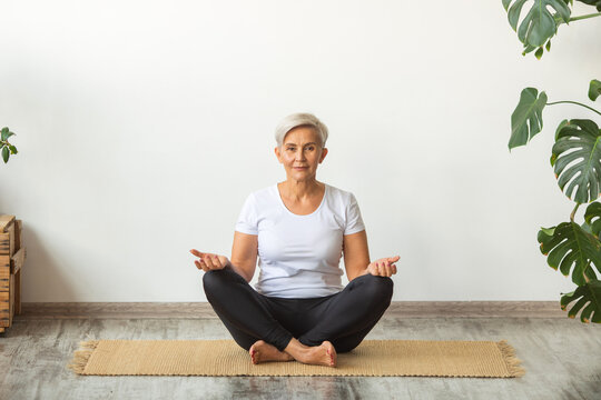 Beautiful Adult Woman Doing Yoga At Home