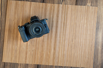 camera on wooden background