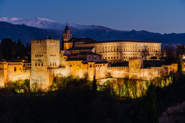 Alhambra palace in Granada at night, view of the whole castle and fortress from San Nicolas lookout