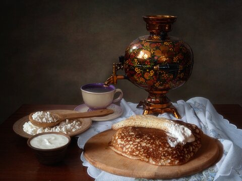 Still life with pancakes and tea from  a samovar