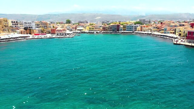 drone flying next to the lighthouse in chania on crete